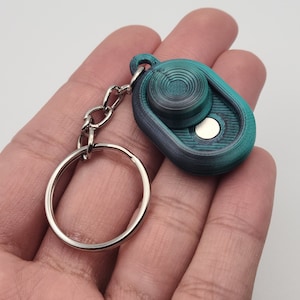Porte-clés jouet magnétique curseur haptique | EDC Fidget personnalisable et multicolore | Interrupteur à bascule