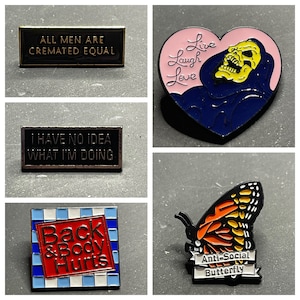 Enamel Pins - Anti-Social Butterfly; No Idea What I’m Doing; All Men are Cremated Equal; Skeletor - Live Laugh Love; Back & Body Hurts