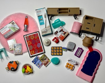 May include: A collection of miniature furniture and household items, including a pink rug, a lava lamp, a small table, a dresser, a trash can, a vacuum cleaner, a magazine, a fruit bowl, a muffin tin, a scale, a toolbox, a drill, a mug, a rug, and a doormat.