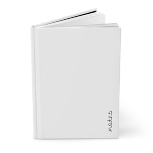 May include: A white blank book with a black spine and the word "notes" written on the bottom right corner of the cover.