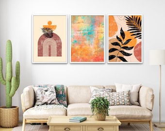May include: Three framed abstract art prints in a modern minimalist style. The prints feature geometric shapes, leaves, and a watercolour-like background in shades of orange, yellow, and brown.