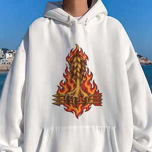 May include: A white long-sleeve hooded sweatshirt featuring a central graphic print of a bird claw clutching three arrows, all surrounded by stylized orange and red flames. The hoodie includes a front kangaroo pocket and ribbed cuffs.