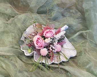 Art arrangement in pink on a ginkgo leaf bowl