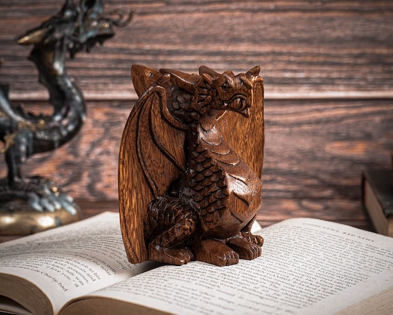 Hand-carved wooden dragon sculpture with articulated wings — 95 favorites don't lie; this is the kind of desk piece that stops visitors mid-sentence.