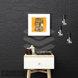 May include: A black framed print of a colorful illustration of a building with multiple storefronts. The building is set against a yellow background. The print is hanging on a black wall with a white nightstand and a lamp in the foreground.