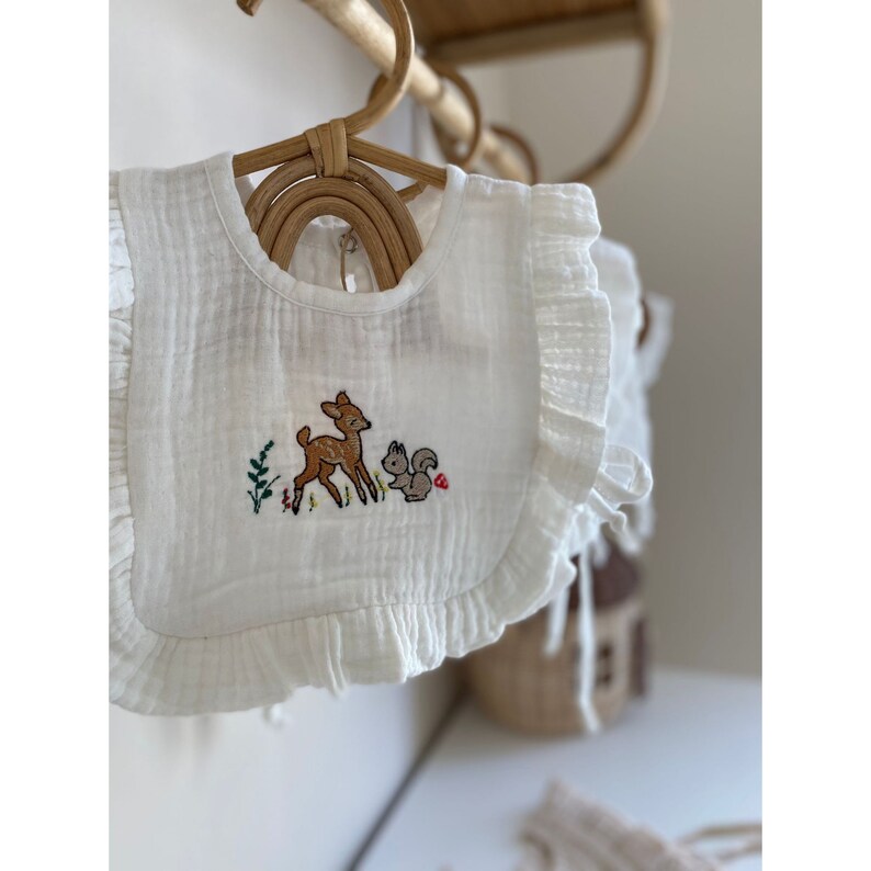 Make mealtime memorable with this personalized soft muslin bib for baby girl, featuring intricate hand-embroidered designs.