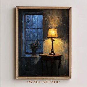 May include: An oil painting depicts a warmly lit lamp on a small table, set against a dark, moody backdrop. A window with a blue-toned view and a vase of flowers are visible. The artwork is framed in a gold-toned wooden frame. The text "WALL AFFAIR" is at the bottom.