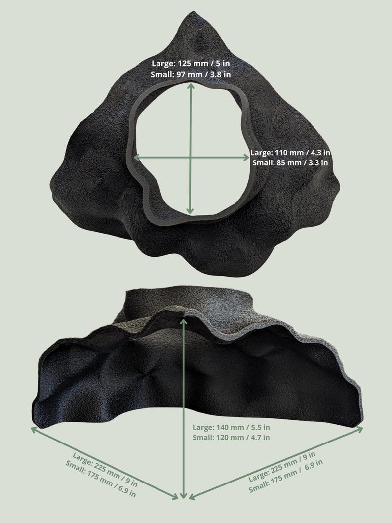 May include: Two black, organically shaped sculptures are shown, one above the other. The top sculpture has a large central opening. Measurements are provided in inches and millimeters: 5 in, 4.3 in, 5.5 in, and 9 in. The bottom sculpture has a similar shape, with measurements of 6.9 in, 4.7 in, and 9 in.