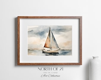 May include: Watercolor painting of a sailboat on the water, framed in a brown wooden frame. The artwork features a white sailboat with a tan sail against a backdrop of blue and tan skies. The text "NORTH OF 21" and "Art Collective" is visible.