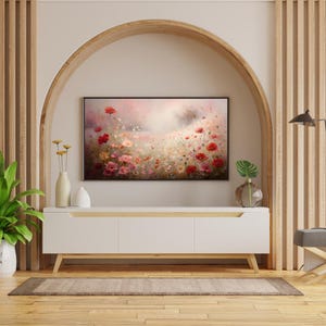 May include: A white media console with three drawers sits in front of a wall with an arched doorway. A painting of a field of pink and red flowers hangs on the wall inside the archway.