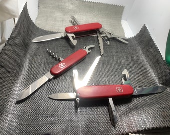 3 couteaux Victorinox Hiker 91 , Huntsman 91 , serveur 84 mm