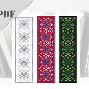 May include: Three cross-stitch bookmark patterns featuring geometric designs. The bookmarks are in white, red, and black with blue, green, and gray accents.