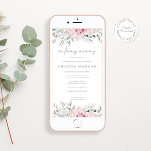 Può includere: Uno smartphone color oro rosa mostra un invito commemorativo digitale. L'invito presenta il testo "in loving memory" e i dettagli per una celebrazione della vita, con accenti floreali in rosa, bianco e blu.