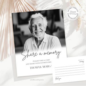 May include: Black and white memorial card with a smiling man's portrait. The card reads "Share a memory" and includes space for sharing memories. A smaller card with lines and the words "thank you" is also present.