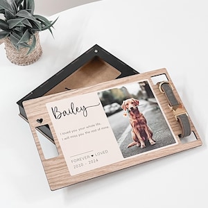 May include: Wooden memorial box with a photo of a dog named Bailey, a collar, and the text "I loved you your whole life, I will miss you the rest of mine. Forever Loved 2010-2024".