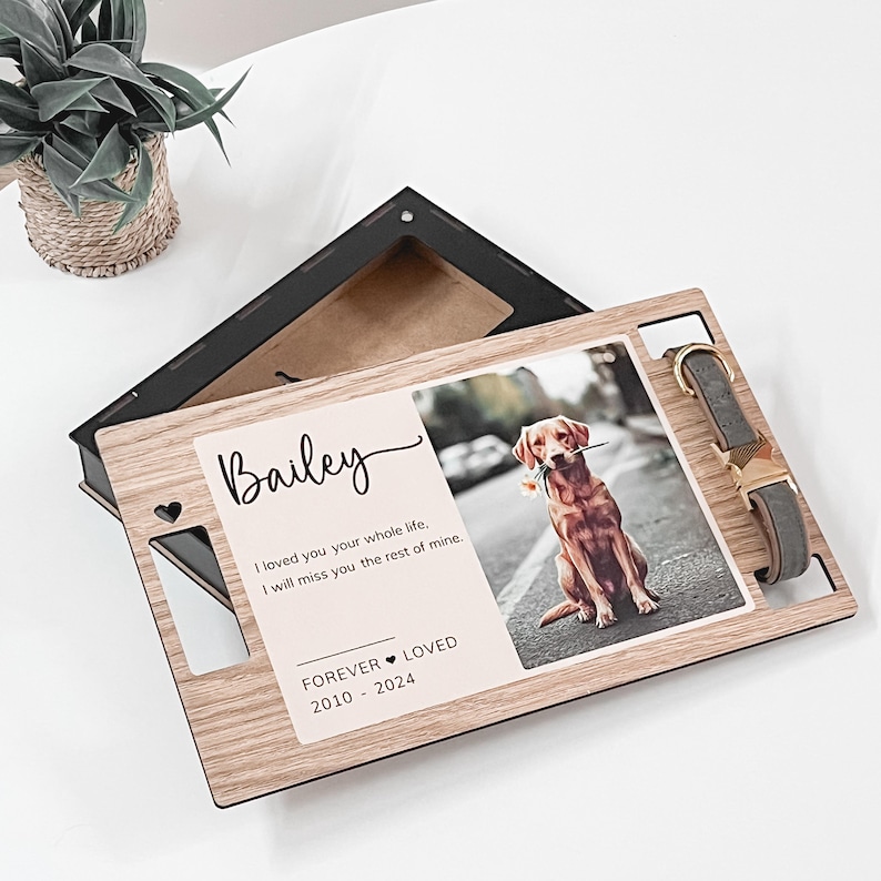 May include: Wooden memorial box with a photo of a dog named Bailey, a collar, and the text "I loved you your whole life, I will miss you the rest of mine. Forever Loved 2010-2024".