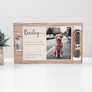 May include: Wooden memorial plaque with a photo of a brown dog holding a flower in its mouth. The plaque has a small glass jar, a dog collar, and the text "Bailey", "I loved you your whole life, I will miss you the rest of mine." and "FOREVER LOVED 2010 - 2024".