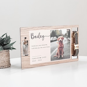 May include: Wooden memorial plaque with a photo of a dog, a small glass jar, and a dog collar. The plaque has the text "Bailey", "I loved you your whole life. I will miss you the rest of mine." and "FOREVER LOVED 2010-2024".