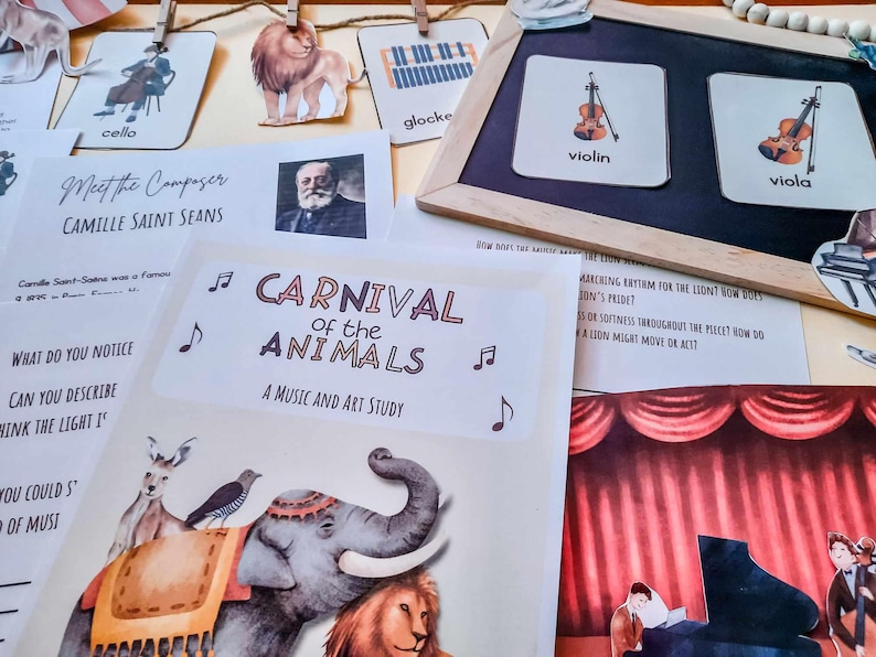 May include: A colorful educational poster for a music and art study of Carnival of the Animals. The poster features a cartoon elephant, lion, and a musical note. The text on the poster reads "Carnival of the Animals, A Music and Art Study".