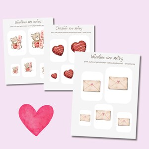 May include: Three Valentine's Day themed sorting activity sheets with illustrations of teddy bears, chocolate hearts, and envelopes. A large pink watercolor heart is in the foreground. Text on the sheets reads "Valentines size sorting" and "Chocolate size sorting."