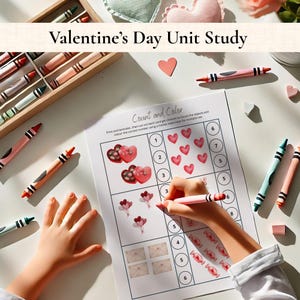 May include: A Valentine's Day unit study worksheet with the title "Count and Color". The worksheet features illustrations of hearts, chocolates, balloons, envelopes, and candies. Crayons in a wooden box and scattered around the worksheet are also visible.