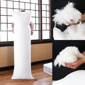 May include: A white body pillow with a zipper closure. The pillow is filled with white hypoallergenic fiberfill. The fiberfill is shown in a separate image.