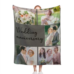 May include: A grey fleece blanket featuring a collage of wedding photographs. The images depict a couple, a bouquet of flowers, and a group of people. The text "Wedding anniversary" is printed in black on the blanket.