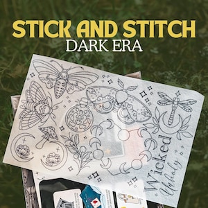 May include: A white fabric sheet featuring black line art of moths, a dragonfly, moons, and botanical elements. The text "STICK AND STITCH DARK ERA" is at the top. The words "Wicked" and "Unholy" are also visible.