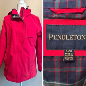 May include: A bright red Pendleton jacket with a hood and a small pocket on the chest. The interior lining features a plaid pattern. The jacket is a size S/CH and made in Vietnam.