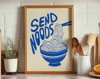 May include: A white framed print with the text "Send Noodles" in blue lettering. The print features a blue bowl of noodles with chopsticks.