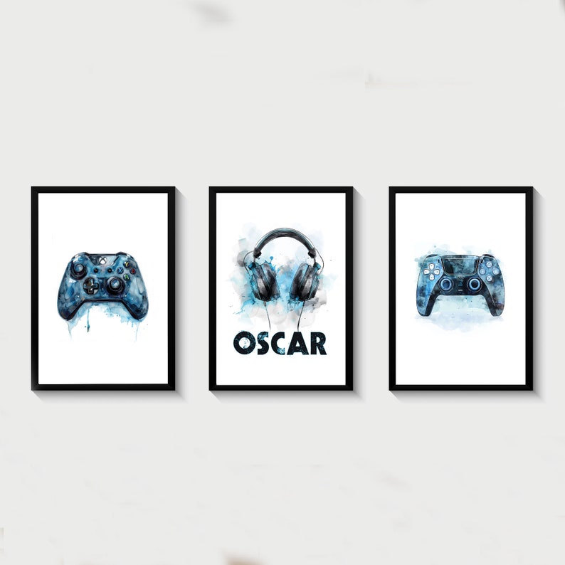 May include: Three framed prints with a watercolor design. The center print features a pair of blue headphones with the name "OSCAR" below. The left print features a blue video game controller. The right print features a blue video game controller.
