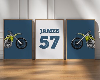 May include: Three framed prints with a motocross theme. Two prints feature a lime green and white motorcycle on a dark teal background. The center print has the name "JAMES" and the number "57" in dark blue on a white background.