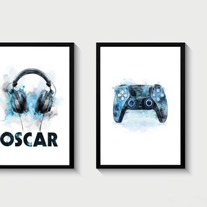 May include: Two framed prints with a watercolor effect. The first print features a pair of blue headphones with the name "OSCAR" below. The second print features a blue video game controller.