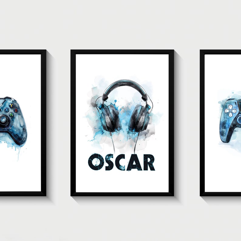 May include: Three framed prints with a blue watercolor background. The center print features a pair of black headphones with the name "OSCAR" in black text. The prints on either side feature a blue video game controller.