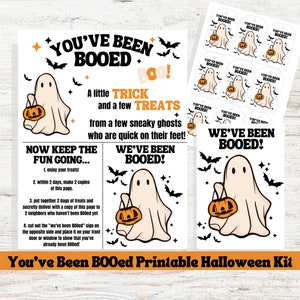 May include: Printable Halloween kit with a ghost holding a pumpkin. The kit includes instructions for a "Boo" game, tags, and a sign that says "You've Been Booed!"