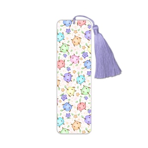 May include: A white ceramic mug with a black handle and the text "But First, Coffee" in a black, handwritten-style font. The mug is on a white surface.