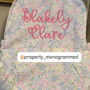 May include: A set of three ceramic mugs with a speckled, matte finish. Each mug features a different color: light blue, cream, and gray. The mugs have a simple, modern design with a rounded shape and a comfortable handle.