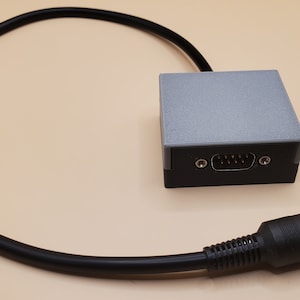 Atari and Sega Genesis Joystick Adapter for TRS-80 Tandy Color Computer 1/2/3/1000 with 3D printed case.