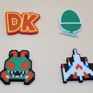 Magneti retrò (quantità da 6, qualsiasi combinazione) Pacman, Frogger, Centipede, Bubble Bobble, Link, Q-bert, Tux, Galaga, Minecraft, Mario, Xbox e molti altri! immagine 5