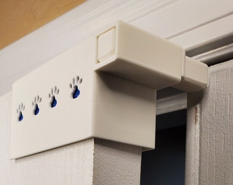 Tope de puerta para mascotas/niños con espuma protectora (sobre la puerta)