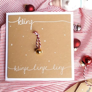 Weihnachtskarte handgemacht 3D-Karte mit Glöckchen, Schneeflocken, Handlettering Glocke in Gold mit Rot Weiß, Kraftpapier, Kupfer Bild 1