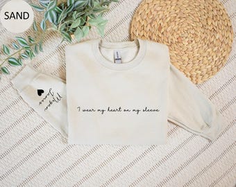 I Wear My Heart On My Sleeve Sweatshirt Personalized Gift for Mom Custom Mama Sweatshirt with Children Name on Sleeve Mothers Day Gift