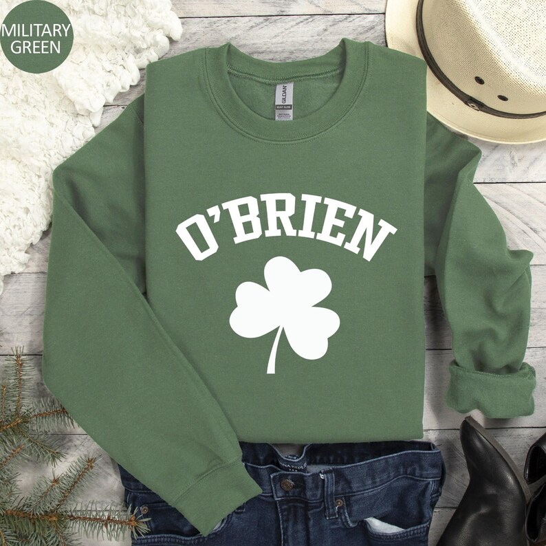 a green shirt that says o'brien with a shamrock on it