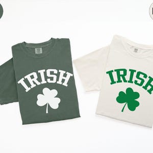two t - shirts with shamrocks on them