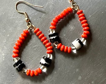 Black and orange teardrop earrings