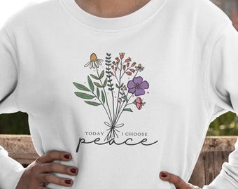 May include: White sweatshirt with a floral design and the text "TODAY I CHOOSE peace" printed on the front.