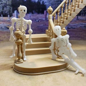 May include: Two white plastic skeleton figurines posed on a set of stairs. The skeleton on the left is standing on a wooden post, while the skeleton on the right is sitting on the stairs.