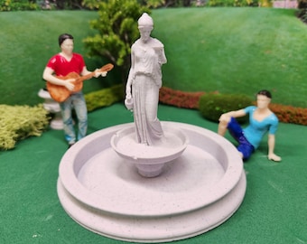 Fuente con estatua a escala 1:24 (media escala), impresa en 3D en color mármol, ideal para casa de muñecas o maqueta. Dos tamaños.
