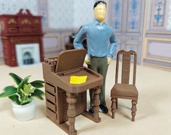 May include: A miniature brown wooden desk with a drawer and a lift-top, a miniature brown wooden chair, and a miniature figure of a person wearing a blue shirt and brown pants.
