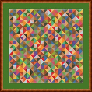 May include: A framed cross-stitch artwork with a geometric design of colourful triangles. The triangles are in shades of red, orange, yellow, green, blue, purple, and brown. The artwork is framed in a brown wooden frame with a green mount.